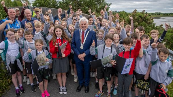 The Mayor of the County of Cork, Cllr. Frank O’Flynn pictured with students, teachers, councilors and local volunteers at the launch of the Harper’s Island Wetlands activity workbooks, a special publication written and designed by renowned local author and educator Jim Wilson.