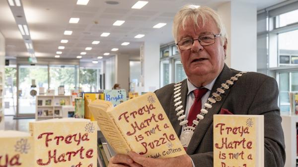 Mayor of the County of Cork, Cllr. Joe Carroll reading 'Freya Harte is Not a Puzzle'.