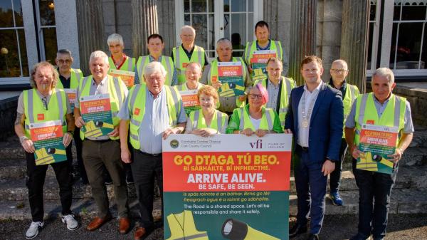 a group of people in safety vests