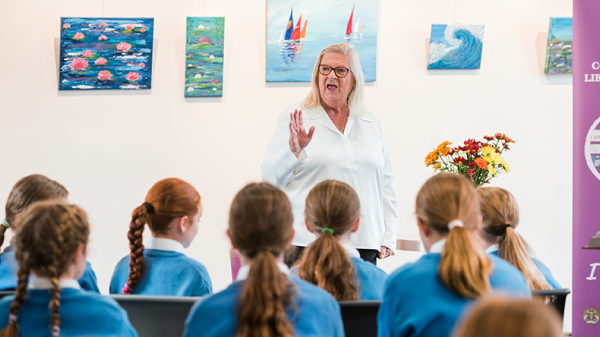 A person standing in front of a group of children