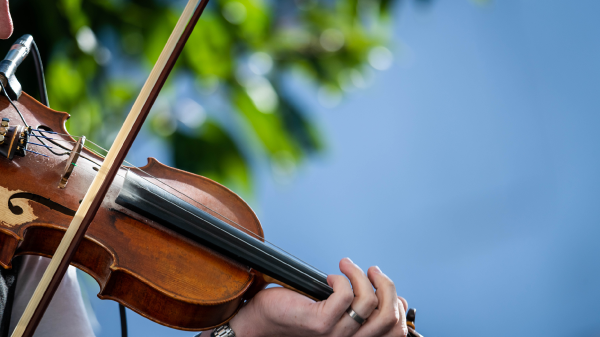 A person playing the fiddle