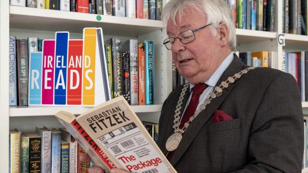 Mayor Joe Carroll reading a book.