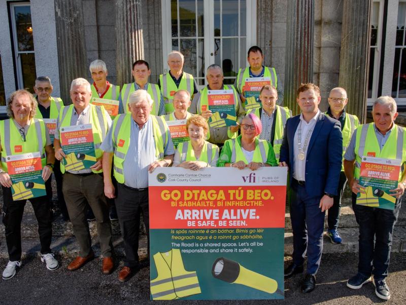 a group of people in safety vests