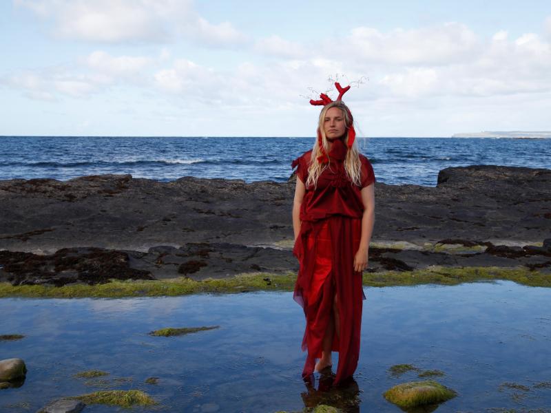 woman standing by ocean 