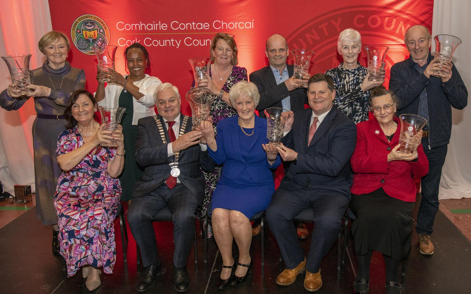 Mayor of the County of Cork, Cllr. Frank O'Flynn and Michael Lynch, Divisional Manager, Cork County Council with the winners on stage at the Mayor's Community Awards.