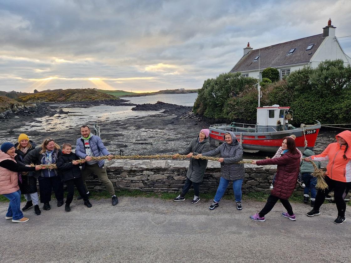 A group of people playing tug of war on Sherkin Island.