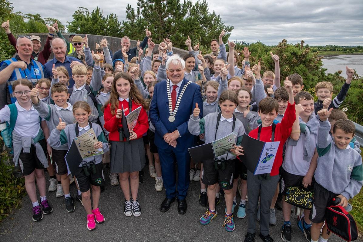 The Mayor of the County of Cork, Cllr. Frank O’Flynn pictured with students, teachers, councilors and local volunteers at the launch of the Harper’s Island Wetlands activity workbooks, a special publication written and designed by renowned local author and educator Jim Wilson.