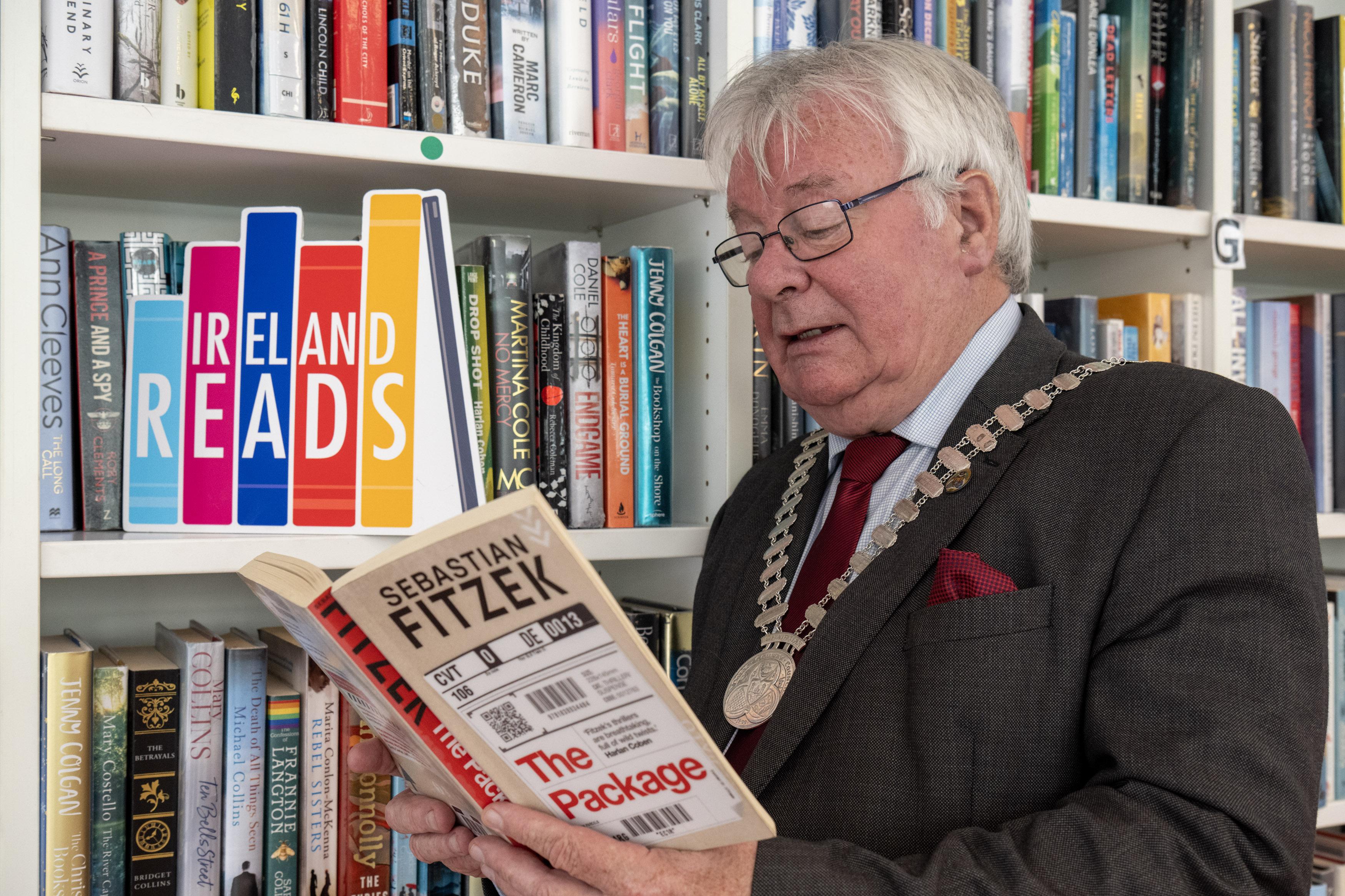 Mayor Joe Carroll reading a book.